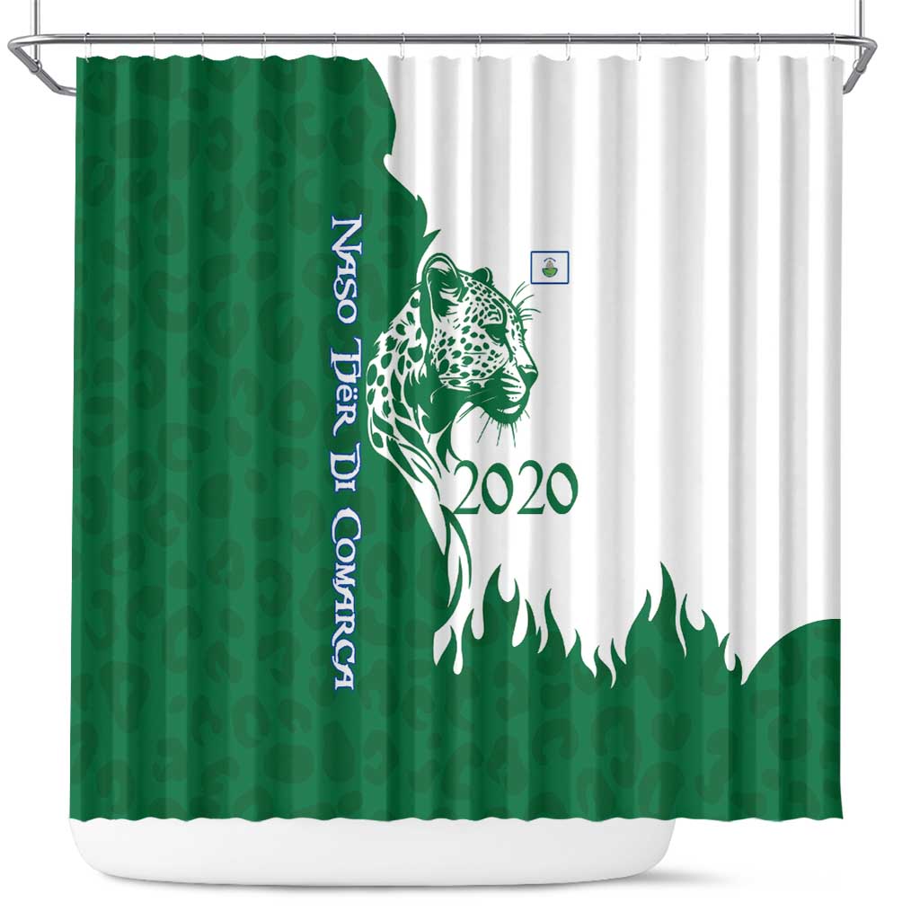 Green and white shower curtain on metal rod, jaguar graphic and 2020 text