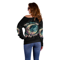Black off-shoulder sweater with “Hello Darkness” moon skull graphic, back view