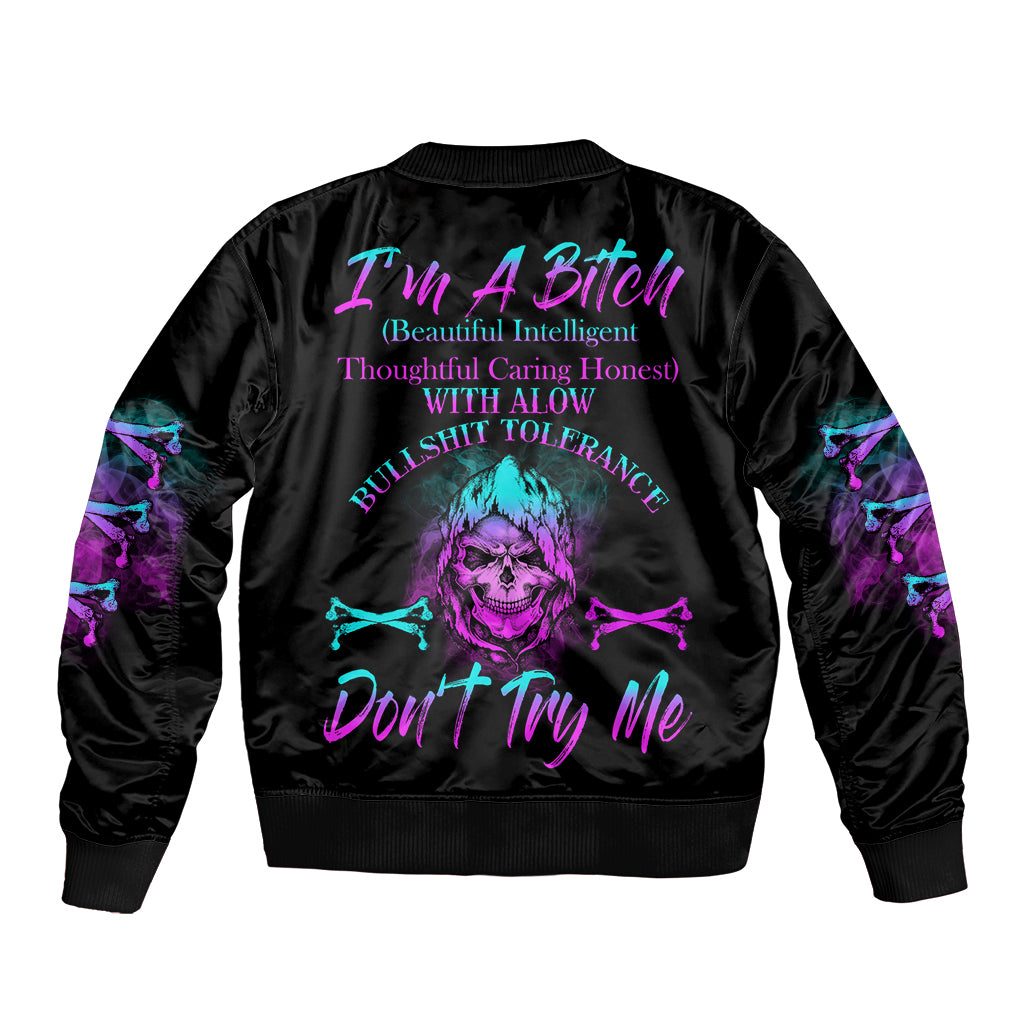 Black bomber jacket with purple/teal skull graphic on back, ribbed collar and cuffs