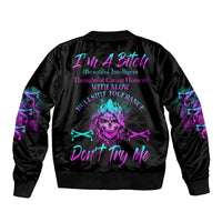 Black bomber jacket with purple/teal skull graphic on back, ribbed collar and cuffs