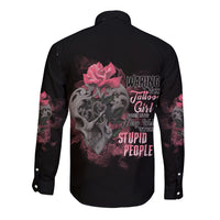 Unisex black long-sleeve button shirt with large skull and roses graphic on back