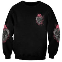 Unisex black sweatshirt with small skull-and-rose graphic on chest and sleeve prints