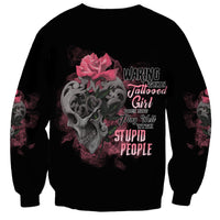 Unisex black sweatshirt with skull, pink rose graphic and multicolor text on front
