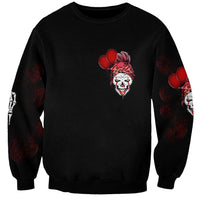 Black sweatshirt with red clown-face graphic and boxing-glove print on sleeves
