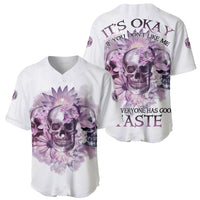 Set of two white baseball jerseys with purple floral skull graphics and quote text