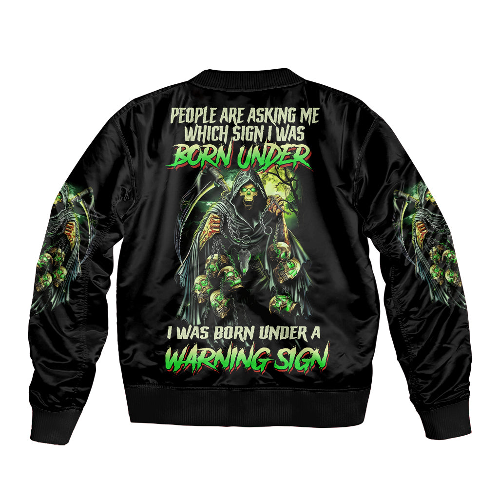 Black bomber jacket with ribbed collar and bold reaper skull warning sign back graphic