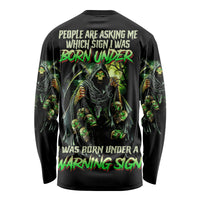 Black long-sleeve shirt with green skull reaper graphic and warning text on back