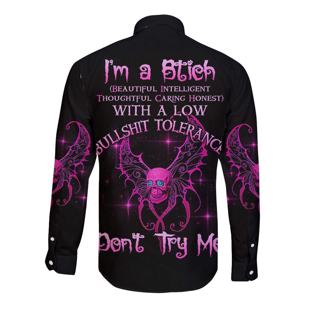 Black long-sleeve button shirt with purple back graphic and central skull design