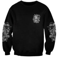 Black crewneck sweatshirt with small chest emblem and skull print on both sleeves