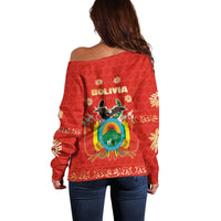 Back view red off-shoulder sweater with Bolivia emblem and floral border