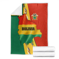 Folded Bolivia flag blanket with crest, country outline, and multicolor Andean condor design