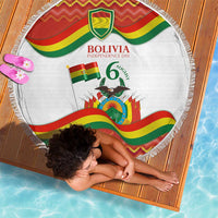 Draped round beach blanket with white Bolivia Independence Day design, flag stripes, fringe