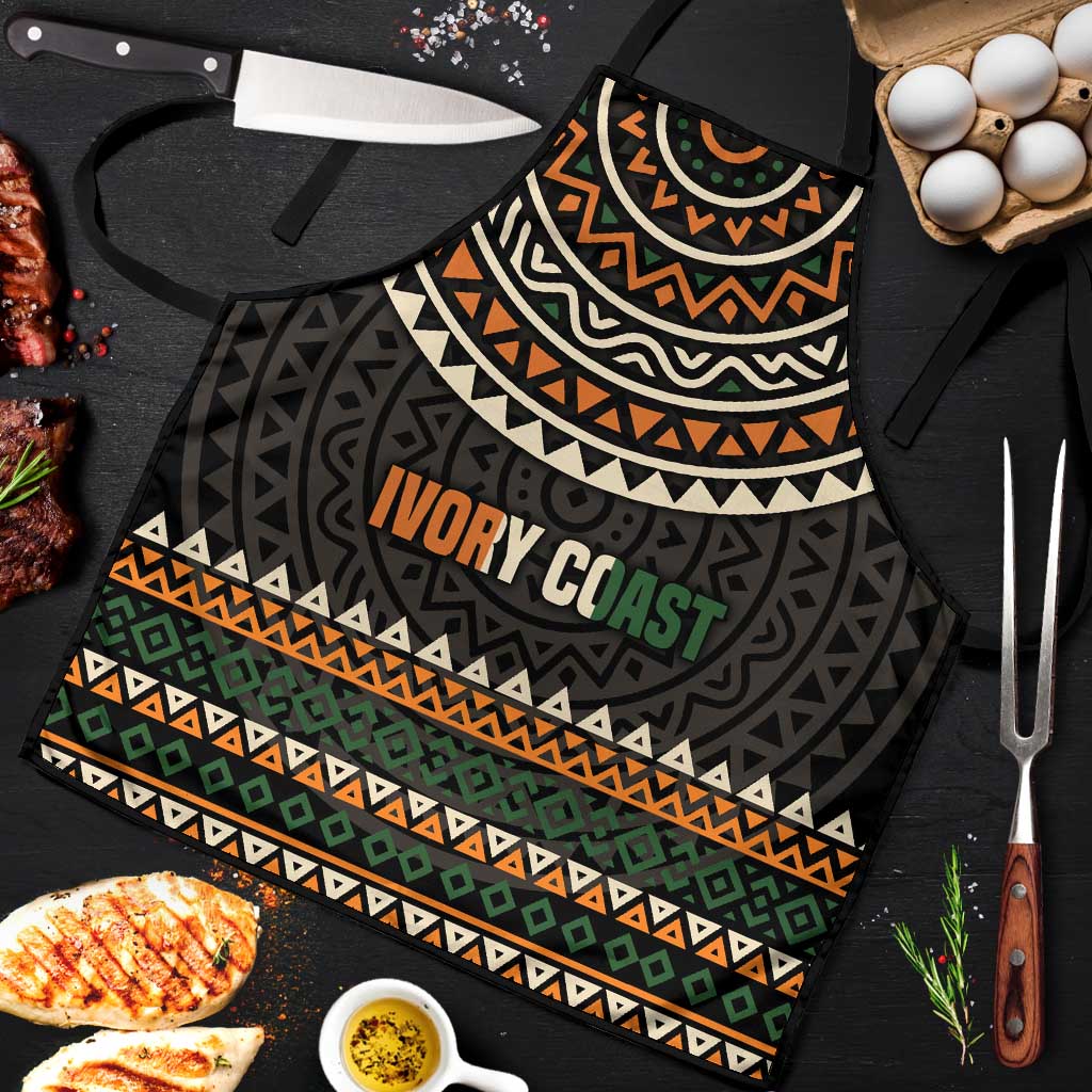 Apron front with dark tribal-style geometric bands and 'IVORY COAST' motto graphic