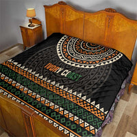 Black quilt with geometric border stripes and “Ivory Coast” center print