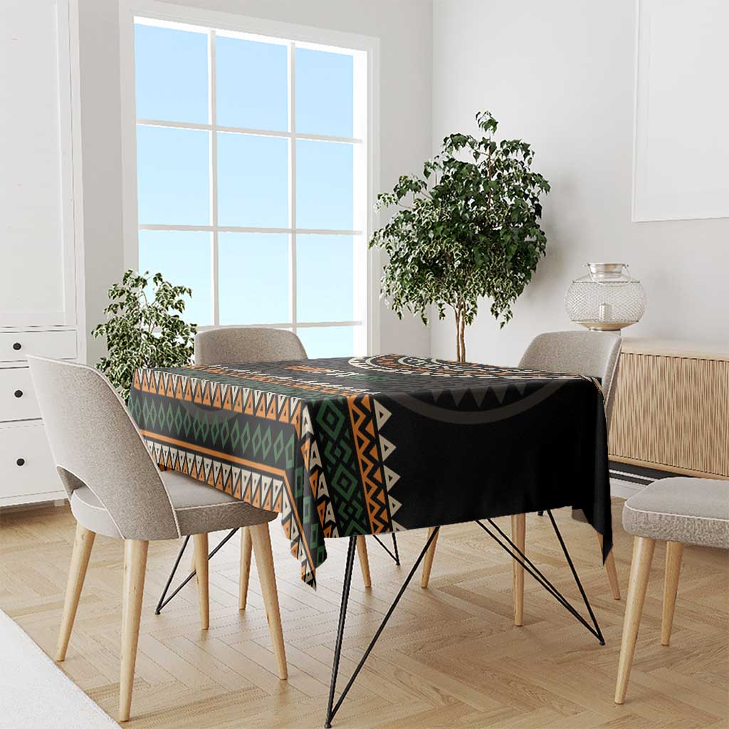 Ivory Coast tablecloth with black, orange, green, and white geometric border