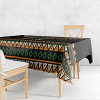 Ivory Coast tablecloth draped on table with black geometric band and zigzags