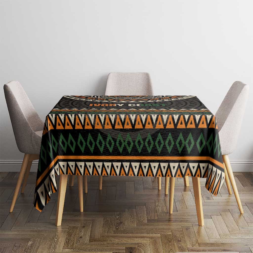 Ivory Coast tablecloth with black geometric stripes in orange, green, and white