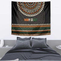 Ivory Coast tapestry, black base with ethnic geometric motifs, orange “IVORY COAST” lettering