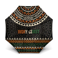 Multicolor Ivory Coast umbrella canopy with geometric motifs and 'IVORY COAST' text