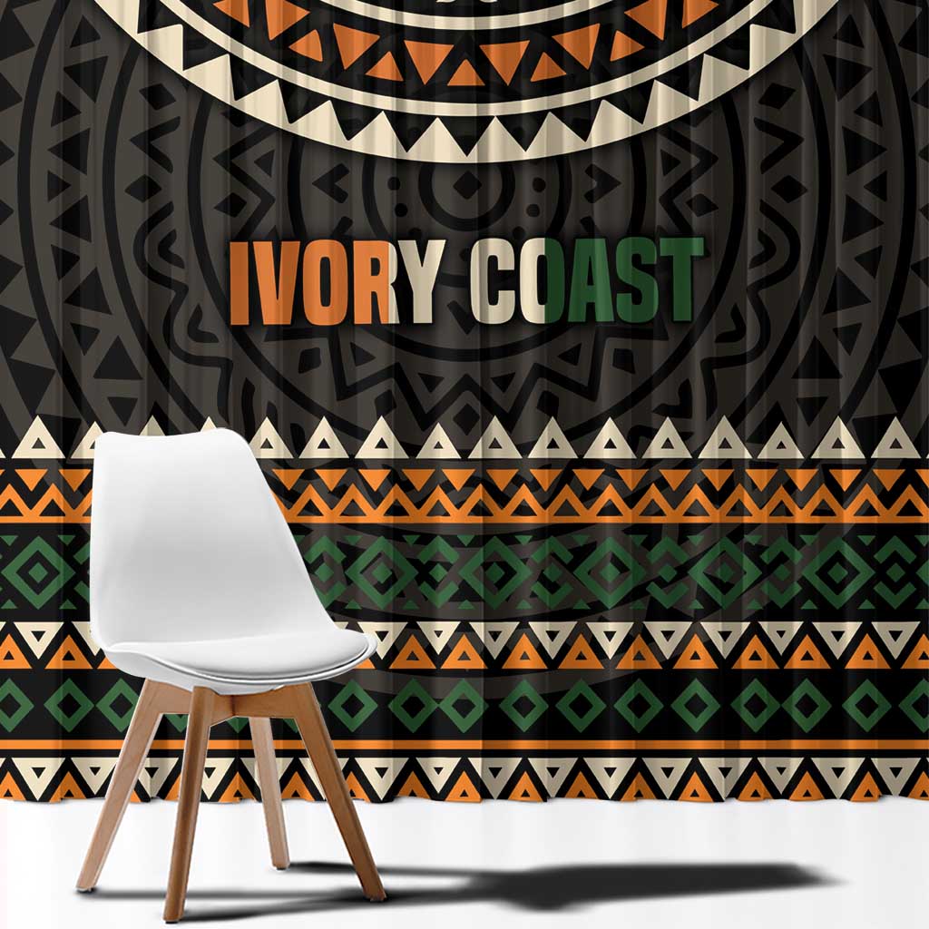Black curtain with multicolor geometric stripes and large 'IVORY COAST' print