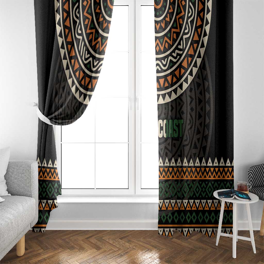 Window curtains in black with multicolor geometric pattern framing a white door