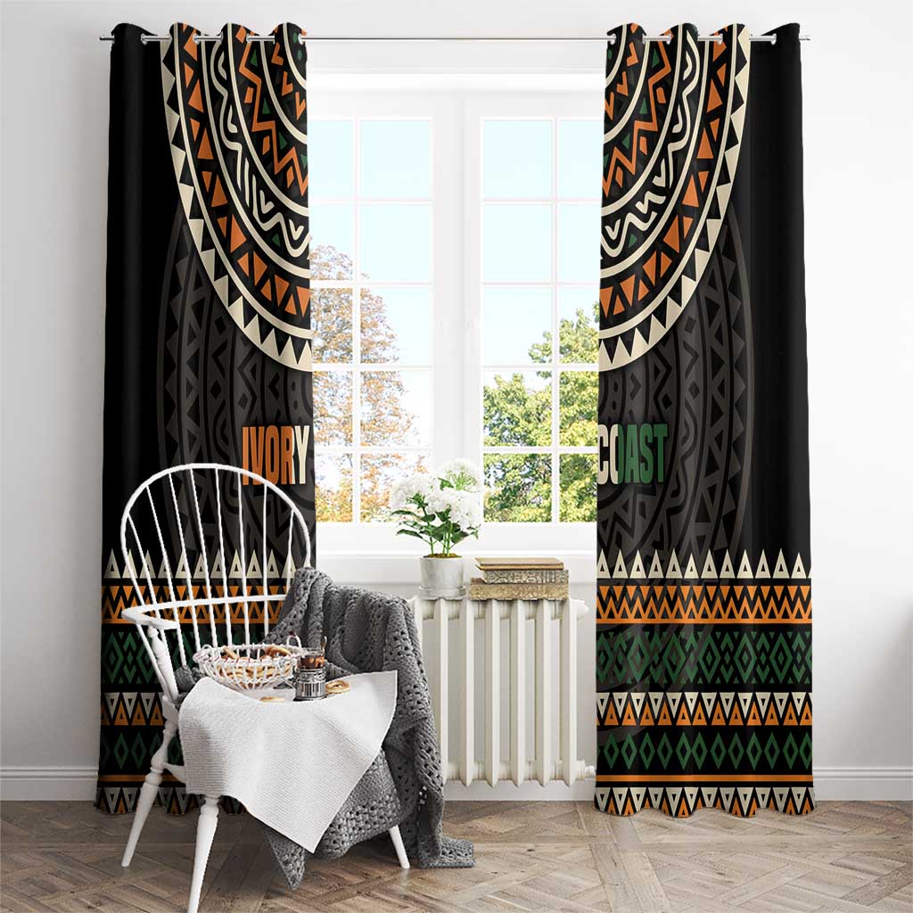 Black window curtains with multicolor geometric pattern and 'IVORY COAST' lettering
