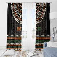 Black window curtains with multicolor geometric pattern and 'IVORY COAST' text panel