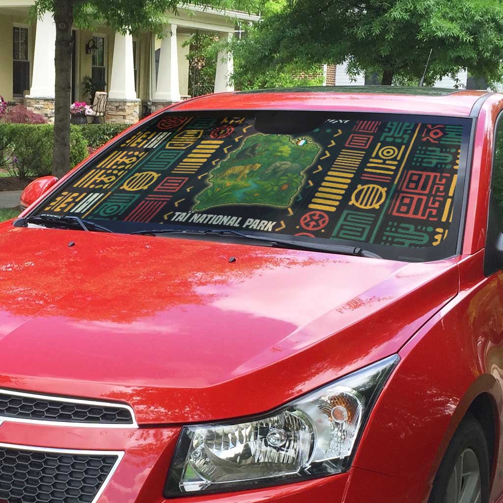 Automotive sun shade with Taï National Park wildlife map design on windshield