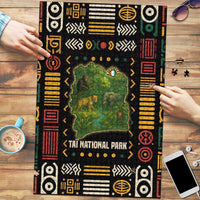 Ivory Coast puzzle with Taï National Park map and wildlife, assembled by hands