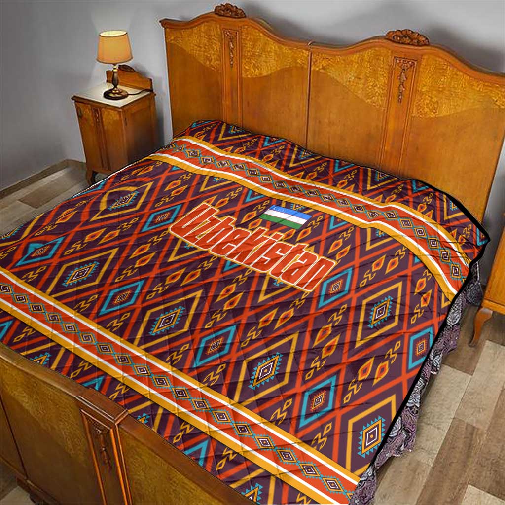 Multicolor Uzbekistan quilt over bed, showing geometric diamonds and orange border