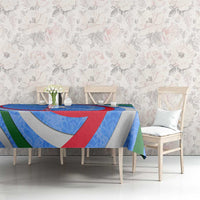 Uzbekistan tablecloth with multicolor crescent, stars, and ornamental swirl pattern on table
