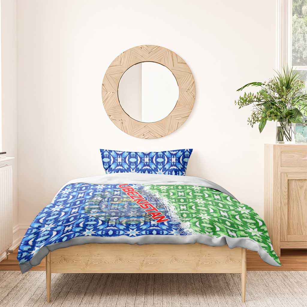 Blue and green patterned duvet with Uzbekistan lettering and emblem, one pillow visible on bed