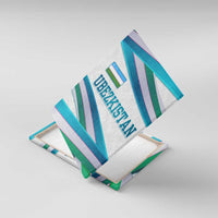 Angled view of Uzbekistan canvas wall art with teal, green, and pink ribbon wave design