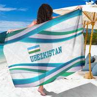 Uzbekistan sarong with turquoise/green/purple wave stripes and ribbon-logo print