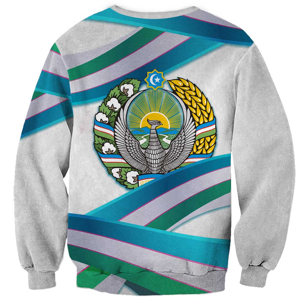 Unisex light gray sweatshirt with back crest emblem on teal, purple, and green stripes