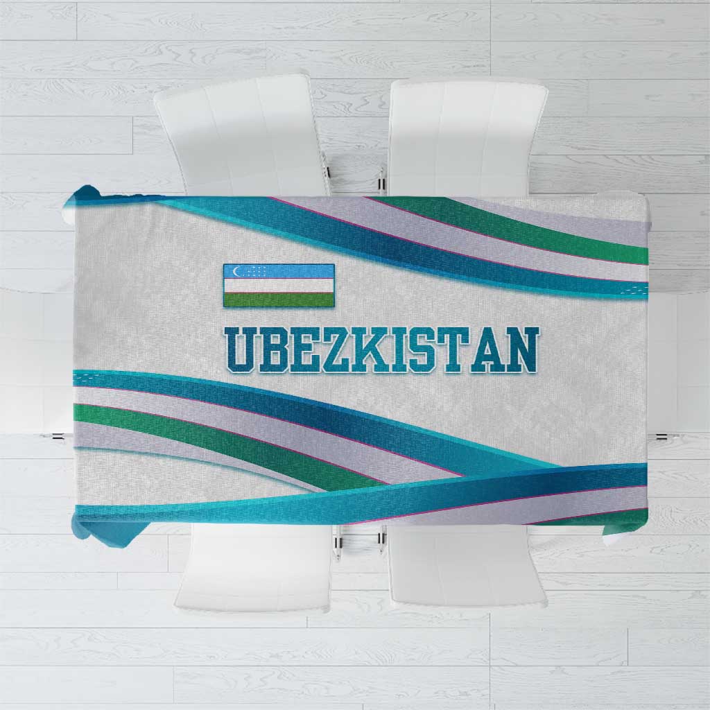 Uzbekistan tablecloth with multicolor ribbon-wave stripes and bold UZBEKISTAN text.