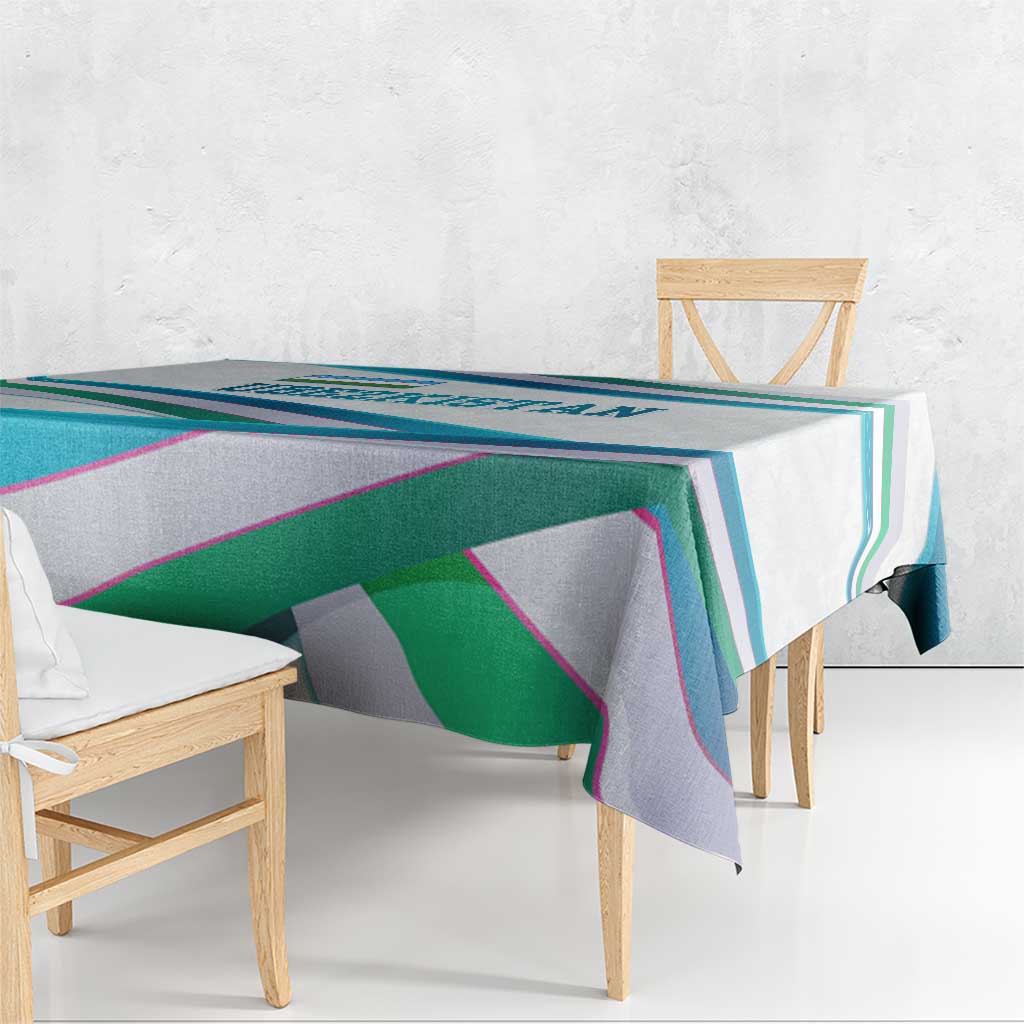 Multicolor ribbon-wave tablecloth with geometric stripes over a table edge.