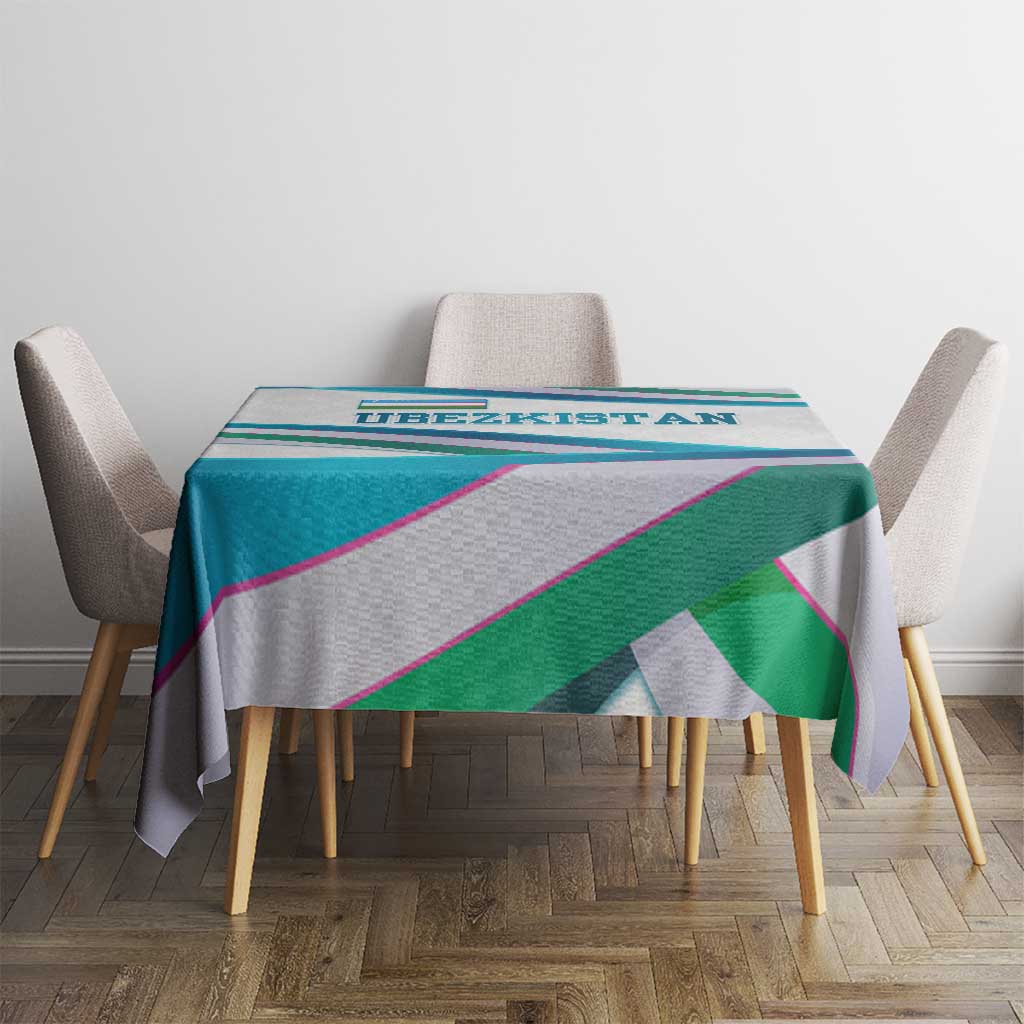 Multicolor ribbon-wave tablecloth on dining table between chairs with patterned top.