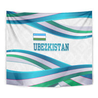 Close-up of Uzbekistan wall tapestry showing ribbon wave stripes and "UBEZKISTAN" text