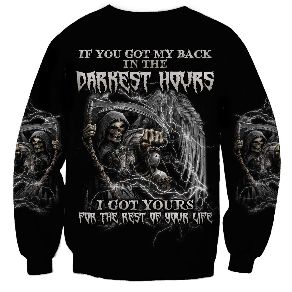 Black crewneck sweatshirt with large back print of skull, angel wings, and text graphic