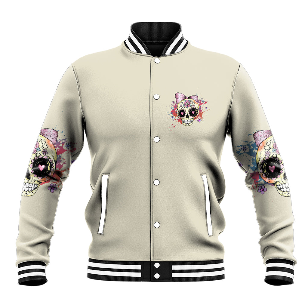 Light gray varsity jacket with button front, striped cuffs, and small skull chest art
