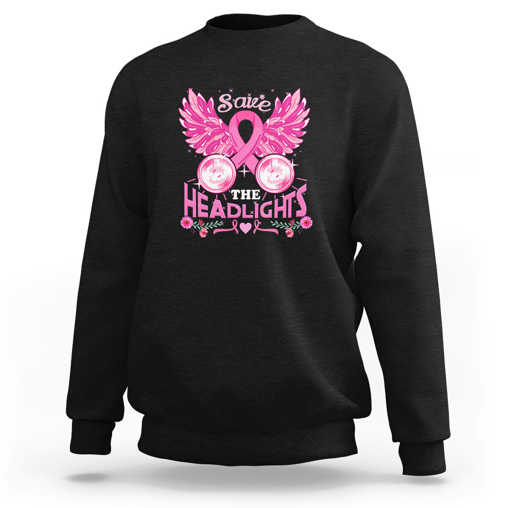 Black crewneck sweatshirt with pink ribbon, wings, and “Save the Headlights” graphic