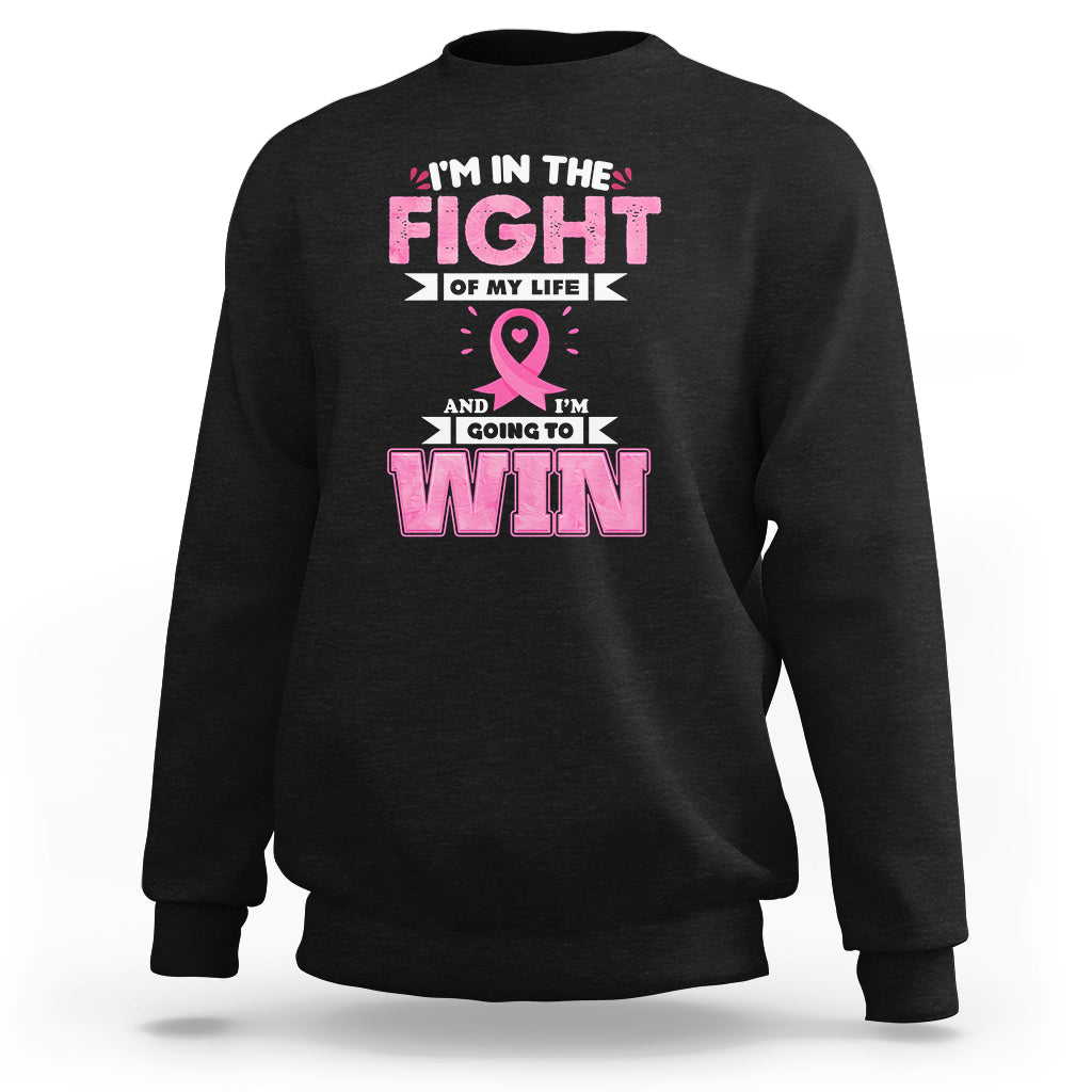 Black crewneck sweatshirt with pink ribbon and 'FIGHT' and 'WIN' graphic print