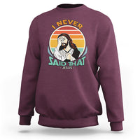 Maroon crewneck sweatshirt with circular Jesus graphic and text on front.