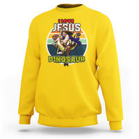 Daisy yellow crewneck sweatshirt with colorful Jesus and dinosaur graphic on chest