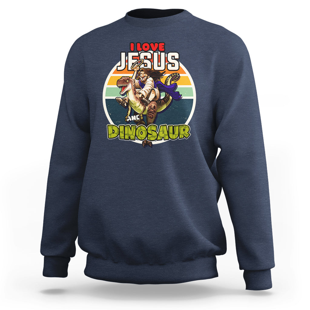 Navy crewneck sweatshirt with colorful Jesus and dinosaur graphic on chest