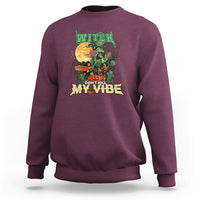 Maroon sweatshirt with witch graphic “DON’T KILL MY VIBE”