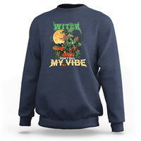Navy sweatshirt with witch graphic reading “DON’T KILL MY VIBE”