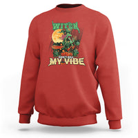 Red sweatshirt with witch graphic “DON’T KILL MY VIBE”