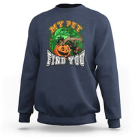 Blue Halloween sweatshirt with front graphic of a jack-o’-lantern and text “FIND YOU”.
